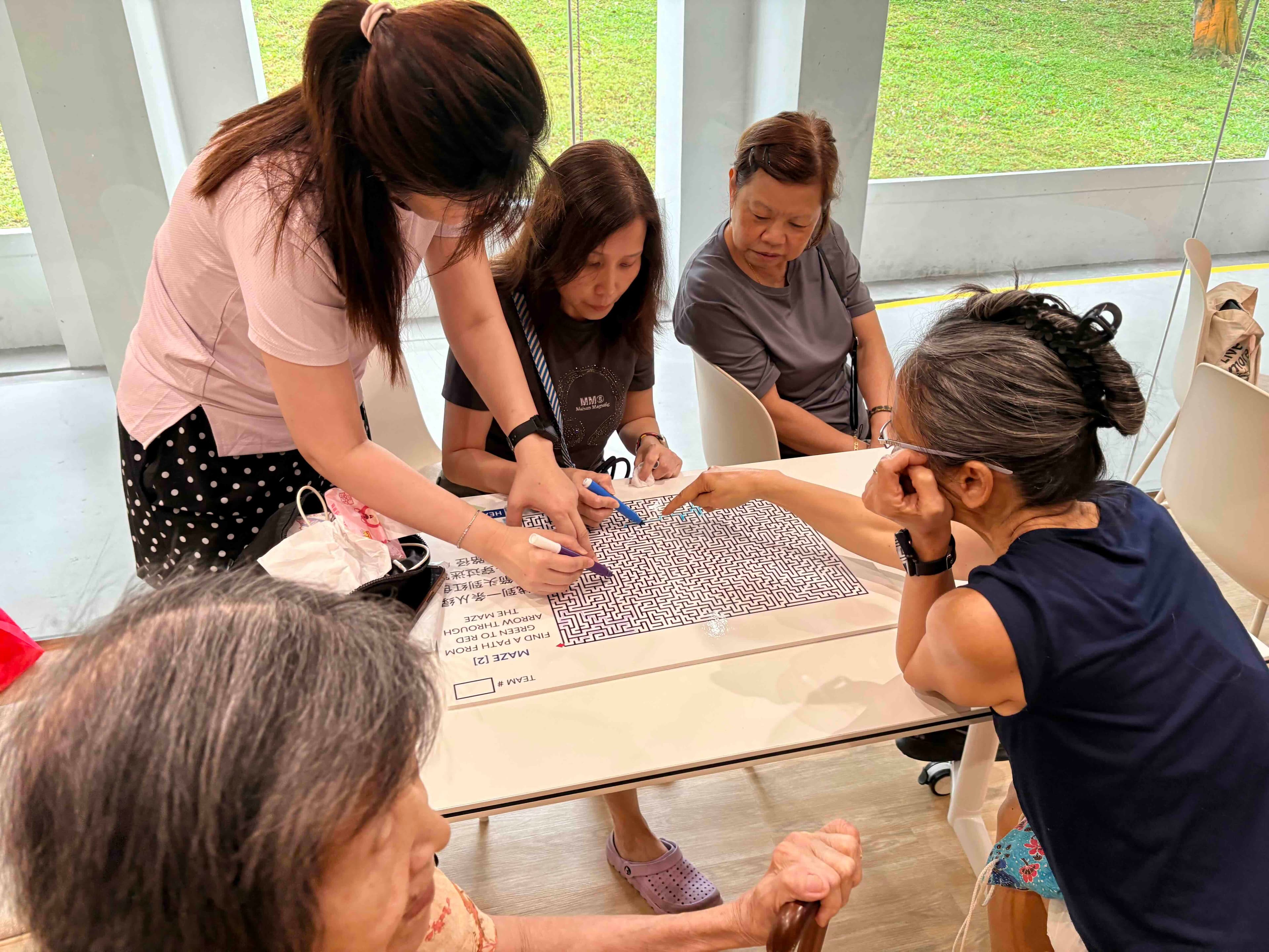 Seniors engage in group board games