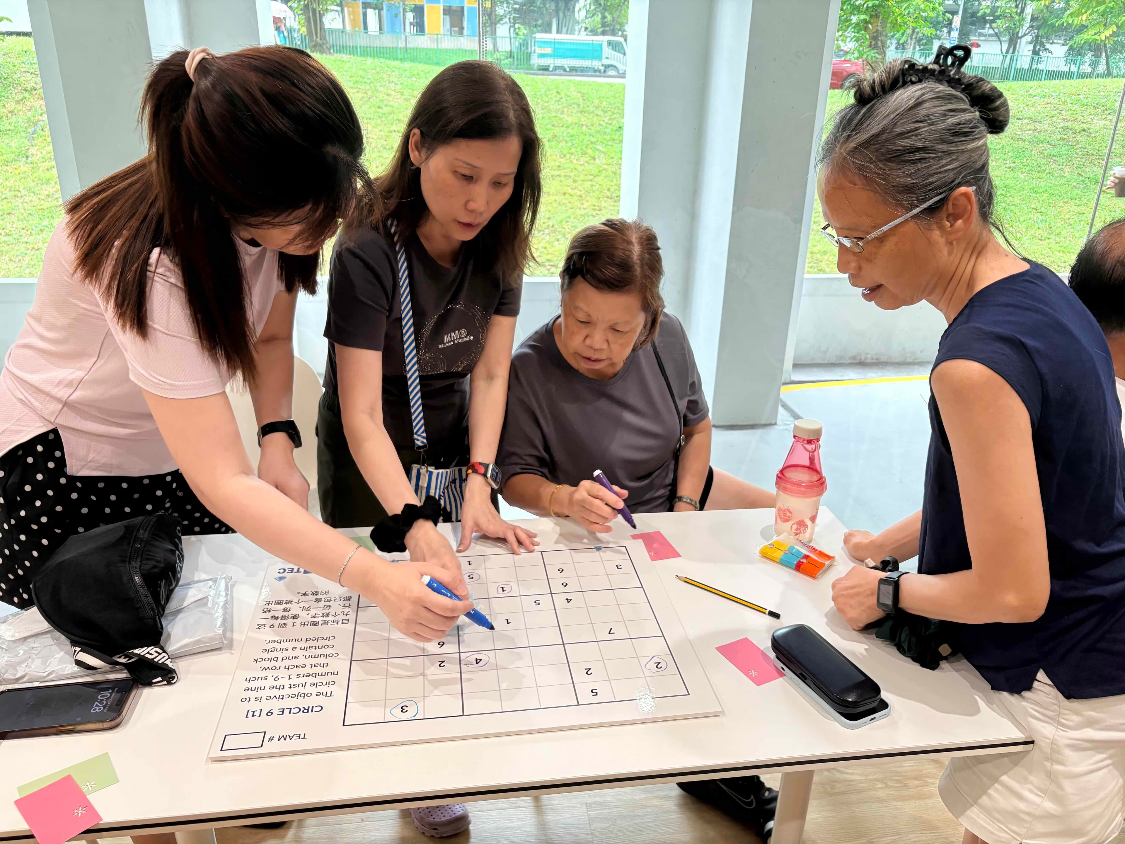 Seniors engage in group board games